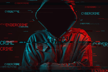 Wall Mural - Cybercrime concept with faceless hooded male person