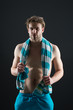 © be free - Sexy man with towel on neck after training. Sportsman with muscular chest and belly. Fitness athlete with fit torso in shorts. Sport and wellness. Hygiene or health and bodycare concept