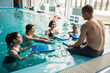 © Nomad_Soul - Trainer works with aqua aerobics group, swimming