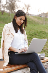 Sticker - Attractive young woman using laptop computer