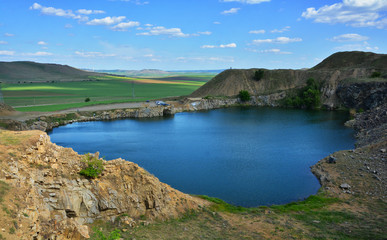 Sticker - Iacobdeal lake ,formed in a collapsed mine gallery, near Macin mountains, Tulcea county, Romania