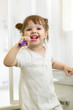 © Oksana Kuzmina - Dental hygiene. Smiling child girl brushing her teeth.
