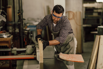 Wall Mural - Professional carpenter at work in his laboratory