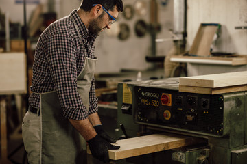 Wall Mural - Professional carpenter at work in his laboratory