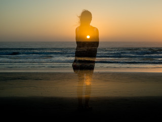 Multi-exposure is a beautiful girl by the sea in sunlight