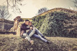 © liderina - Portrait of young couple sitting in nature.