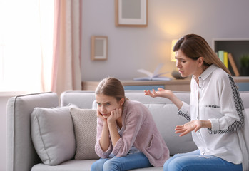 Wall Mural - Mother arguing with daughter at home