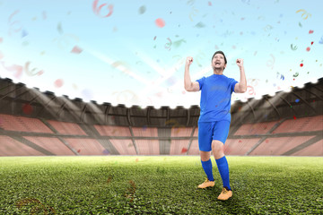 Poster - Attractive asian male football player celebrate victory