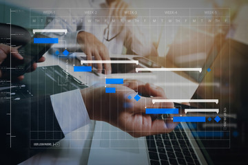 Wall Mural - businessman making presentation with his colleagues and business strategy digital layer effect at th