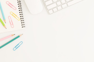 Wall Mural - flat lay photo of office desk with mouse and keyboard white copy space with pencil top view