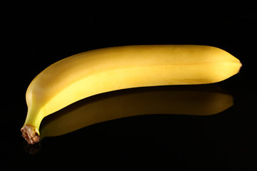 Poster - Banana on a dark glossy background