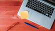 Computer pc and office objects lie on a wooden red background