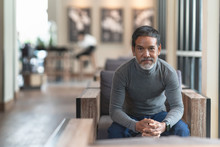 Portrait Of Happy Mature Man With White Stylish Short Beard Looking At Camera. Casual Lifestyle Of Retired Hispanic People Or Adult Asian Man Smile With Confident Sitting At Modern Coffee Shop Cafe.