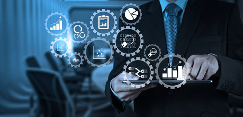 Poster - Businessman hand working with a digital tablet on meeting room