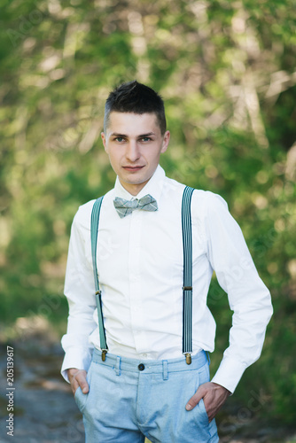 blue pants white shirt black tie