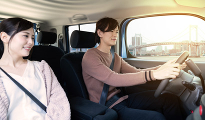 Young couple in the car cockpit.