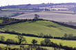 English countryside with low sun showing medieval ridge and furrow field system