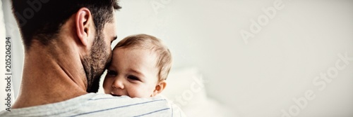 Fotomural Father holding his baby girl