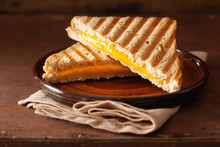 Grilled Cheese Sandwich On Rustic Brown Background