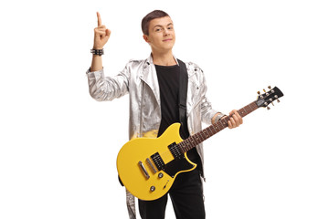 Wall Mural - Teenage rocker with an electric guitar holding his index finger up