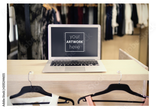 Download Laptop On Table In Clothing Store Mockup Stock Template Adobe Stock