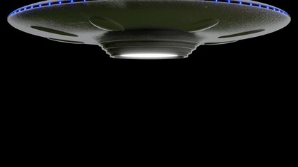 Wall Mural - ufo flying saucer on black background rotates down from top of screen. stops then rotates fly's up t