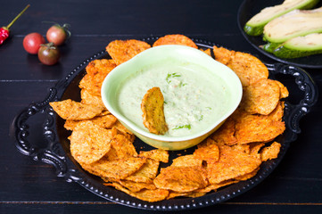 Wall Mural - Tortilla chips with avocado dip on a plate