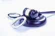 Judge gavel and handcuffs on white background as a symbol of justice and punishment