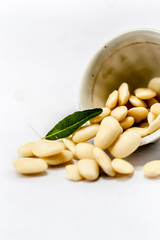 Hyacinth Beans or Lablab or Lablab purpureus or valor na bea in a bowl isolated on white.