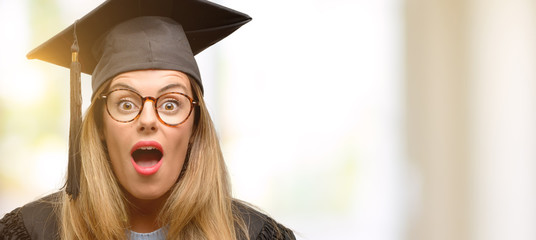 Poster - Young woman university graduate student scared in shock, expressing panic and fear