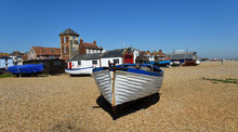 Aldeburgh Beach With Boats And Old Lifeboat Station With Tower.