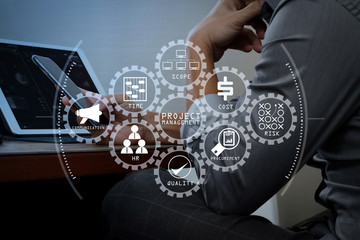Wall Mural - success businessman hand using smart phone,digital tablet docking smart keyboard on wood desk