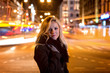 © ako-photography - Beautiful, blonde woman in car lights in the night city.