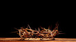 An authentic crown of thorns on a wooden background. Easter Theme