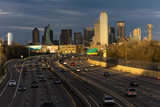 Fototapeta  - MARCH 5, 2018, DALLAS SKYLINE TEXAS, and Tom Landry Freeway, with streaked lights on Interstate 30 at night