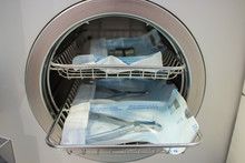 Sterilizing Medical Instruments In Autoclave. Equipment For Sterile Cleaning Of Working Medical Instruments