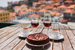 © Ekaterina Pokrovsky - Madeira wine, coffee and hohey cake, View to Funchal, Portugal