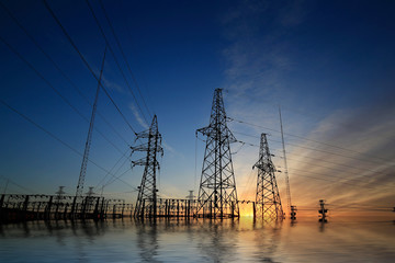 Wall Mural - A high voltage substation in the sky at sunrise