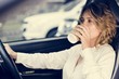 © Rawpixel.com - Woman drinking coffee in a car
