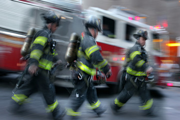 fire trucks and firefighters brigade in the city