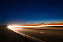 The Asphalt Road In The Countryside With The Light Passing Through It At The Speed Of Cars On Long Exposure