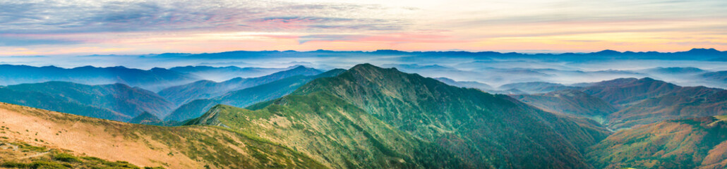 Wall Mural - Panorama with landscape of mountains and blue hills at sunset