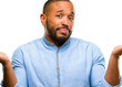 © Krakenimages.com - African american man with beard doubt expression, confuse and wonder concept, uncertain future isolated over white background