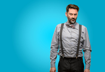 Poster - Middle age man, with beard and bow tie irritated and angry expressing negative emotion, annoyed with someone