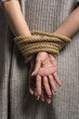 © Adam Radosavljevic - Hands on back tied with a rope