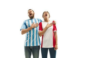 The Argentinean soccer fan celebrating on white background