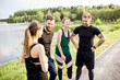 © rh2010 - Sports team having fun standing together after the training outdors in the park near the lake