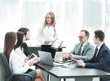 © yurolaitsalbert - Businesswoman explaining business plan to her colleagues