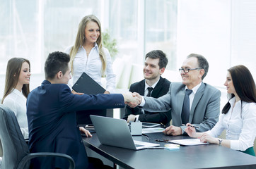 business partners shaking hands after a successful transaction