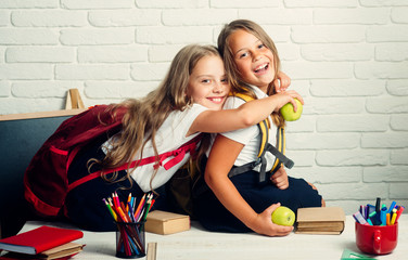 Back to school and home schooling. little girls back to school at knowledge day.